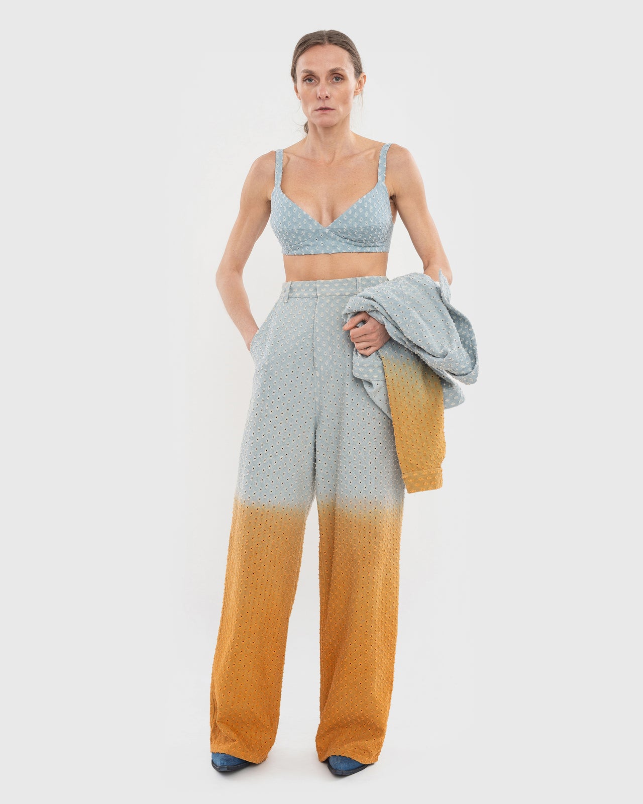 Buy Perforated Jeans with Orange Gradient – Bottoms by Ksenia Schnaider | Ethical & Sustainable Fashion